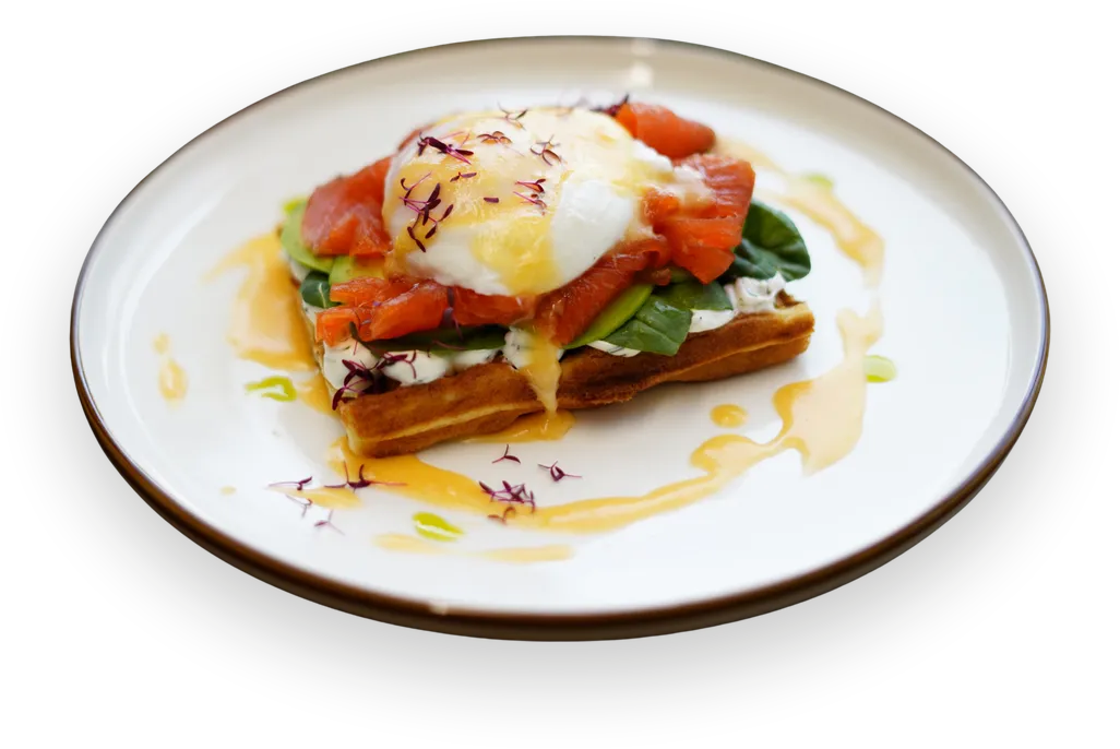 Salmon Benedict with a poached egg on a Belgian waffle